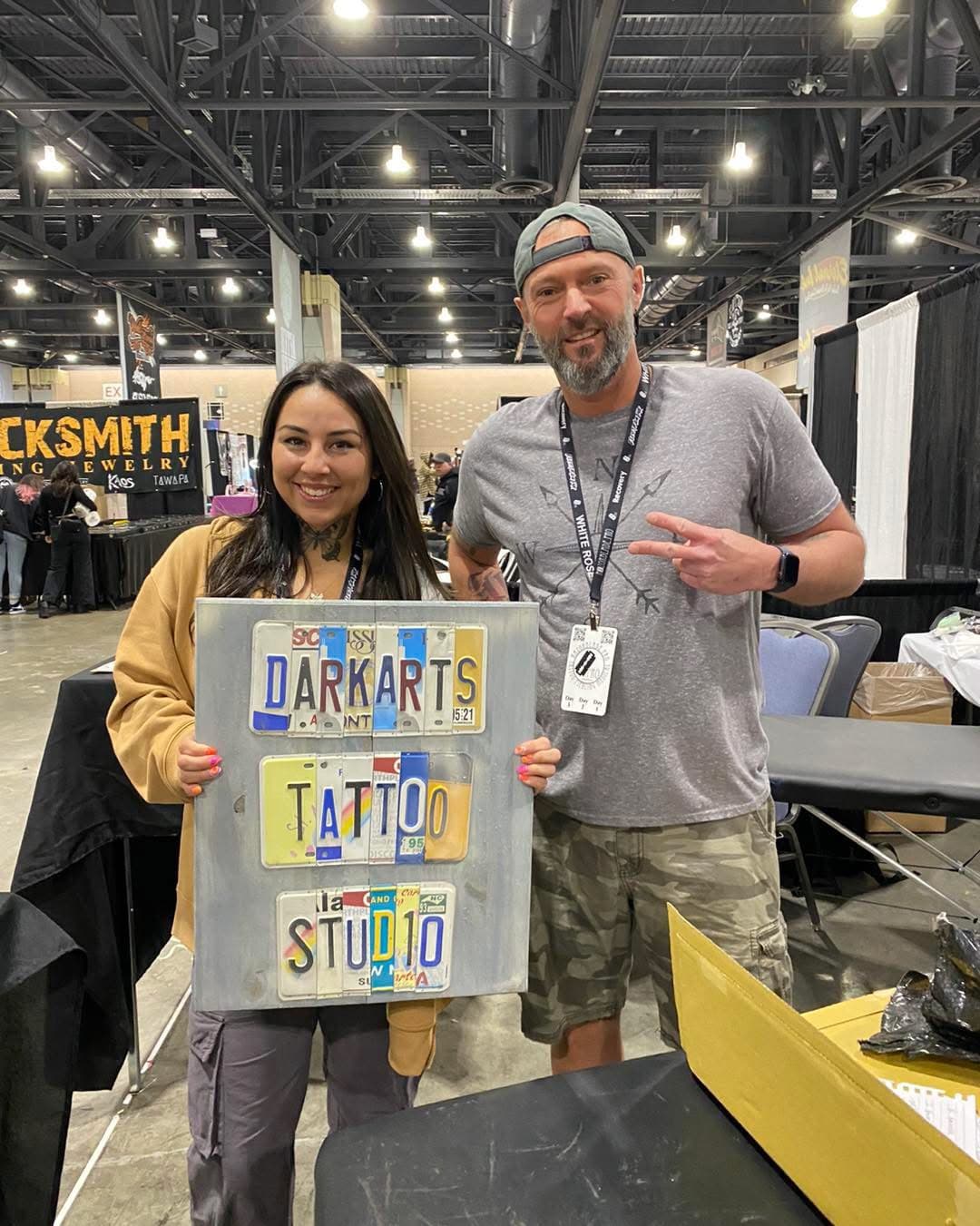 DarkArts Tattoo Studio custom license plate sign with happy customers